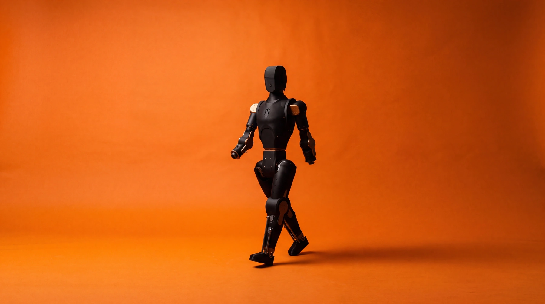 Teaching a humanoid to walk: The RL policy behind Asimov's first steps